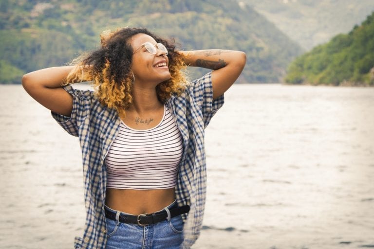 Smiling girl in outdoor lake setting